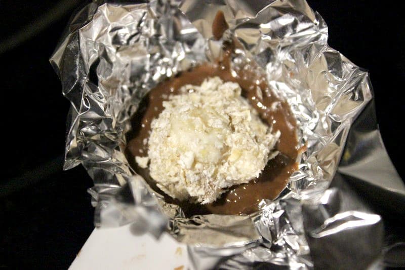 Mold foil and spoon liquid chocolate peanut butter.